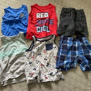 4 boys tank tops and 2 pairs of shorts
